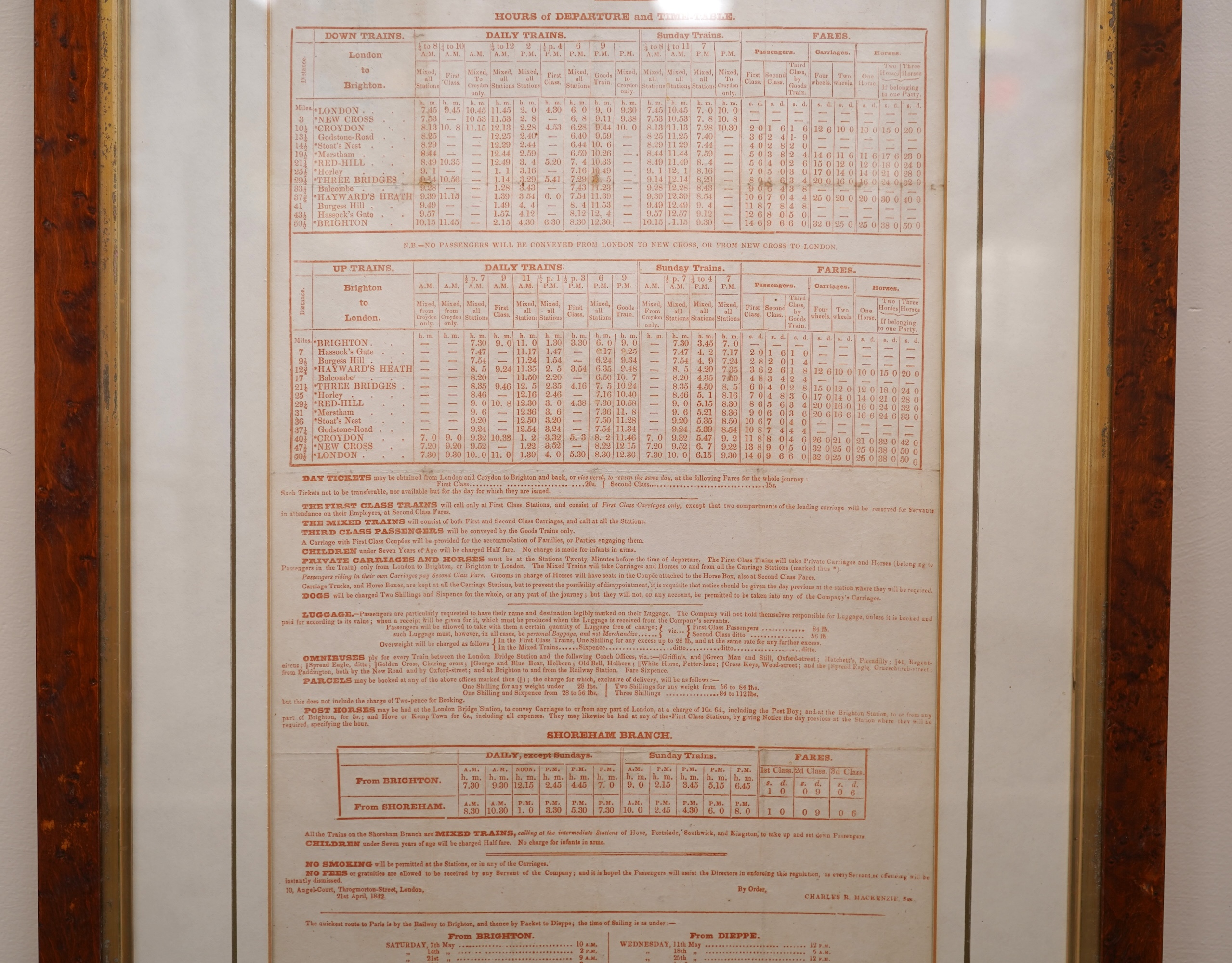 A framed London and Brighton railway timetable ‘On and after May the 1st, 1842’ including the Shoreham branch line at the bottom of the page, in a walnut frame, dimensions of the frame 62 x 44cm